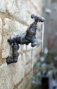 Frozen outdoor faucet with icicles in Central PA