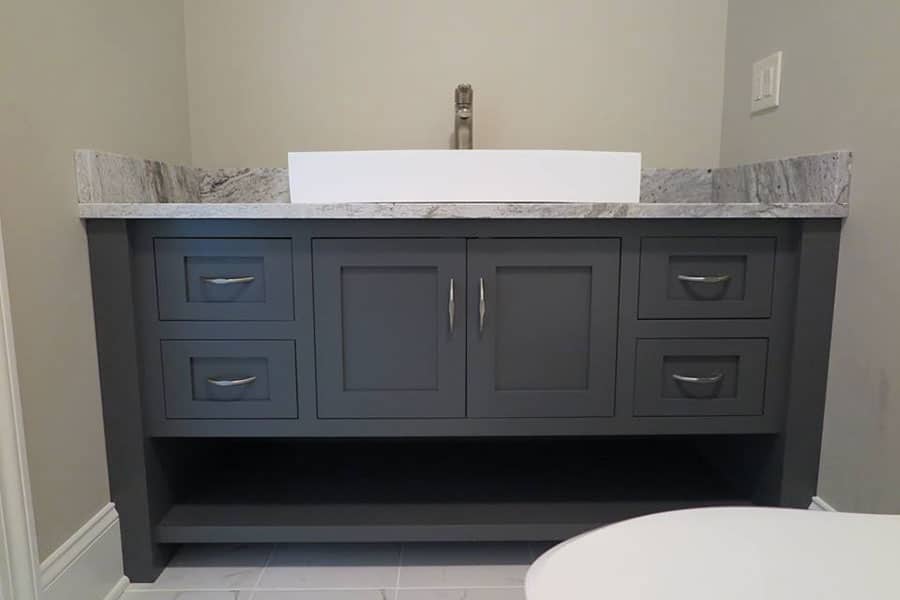 Remodeled bathroom vanity with vessel sink