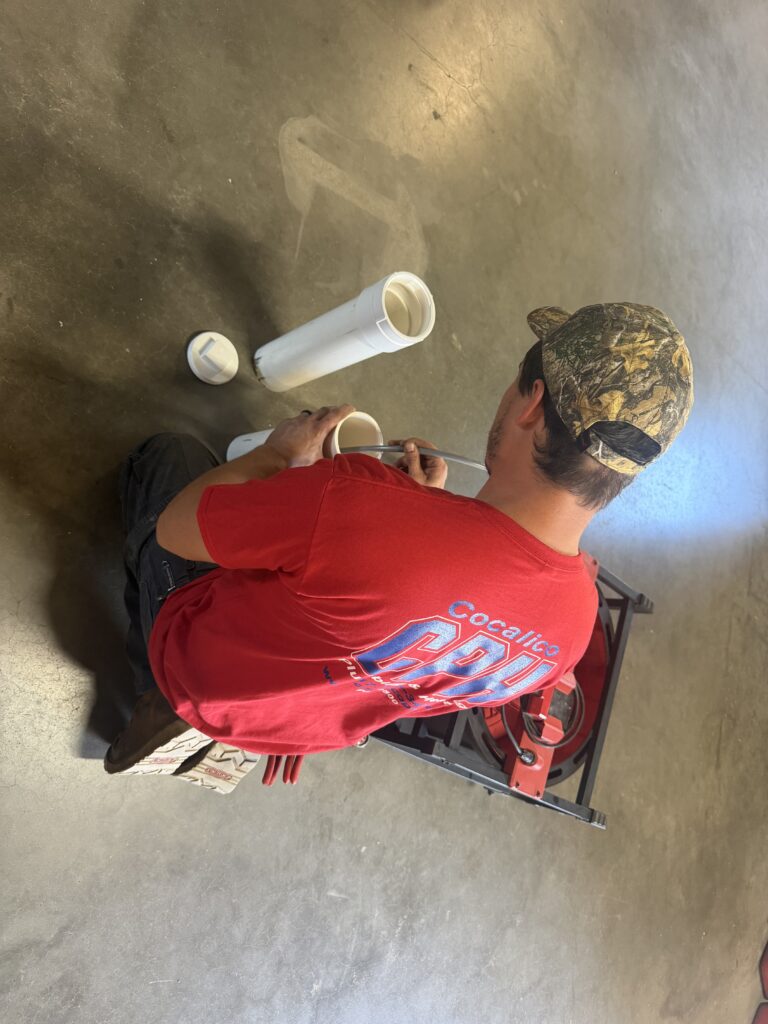 Plumber prepping PVC drain pipe in Robesonia, PA