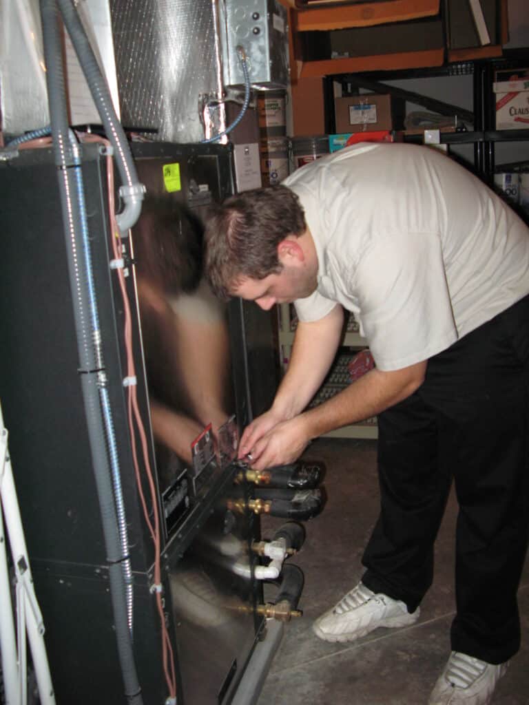Technician servicing heating equipment in Stevens, PA