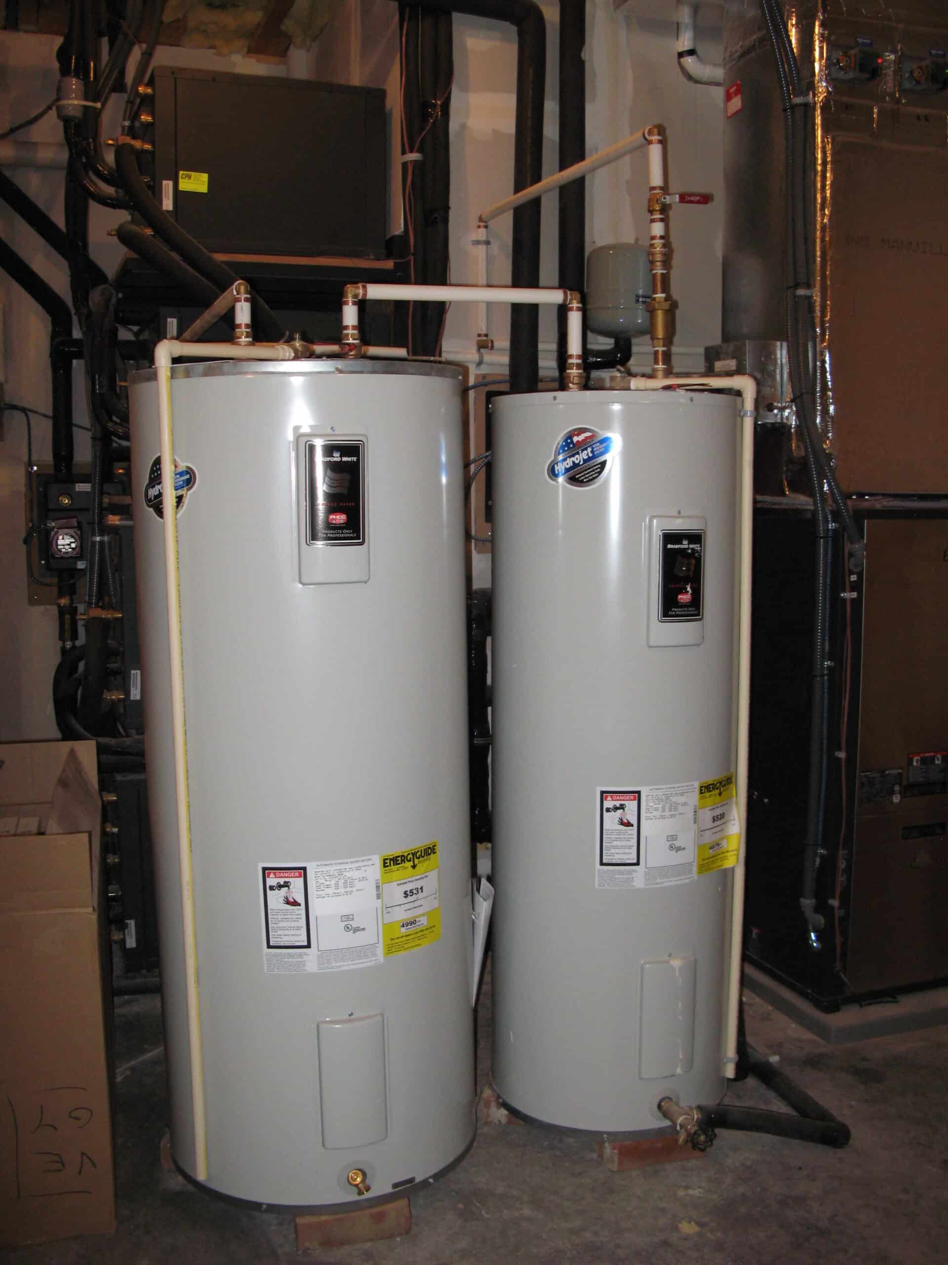 Two tank water heaters installed in a basement